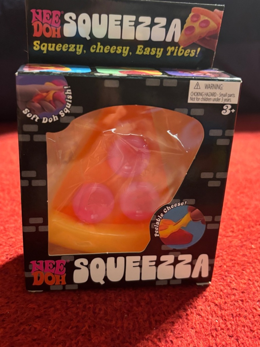 Nee Doh Squeezza Pizza Squishy Toy - Orange & Pink with Yellow Crust. New